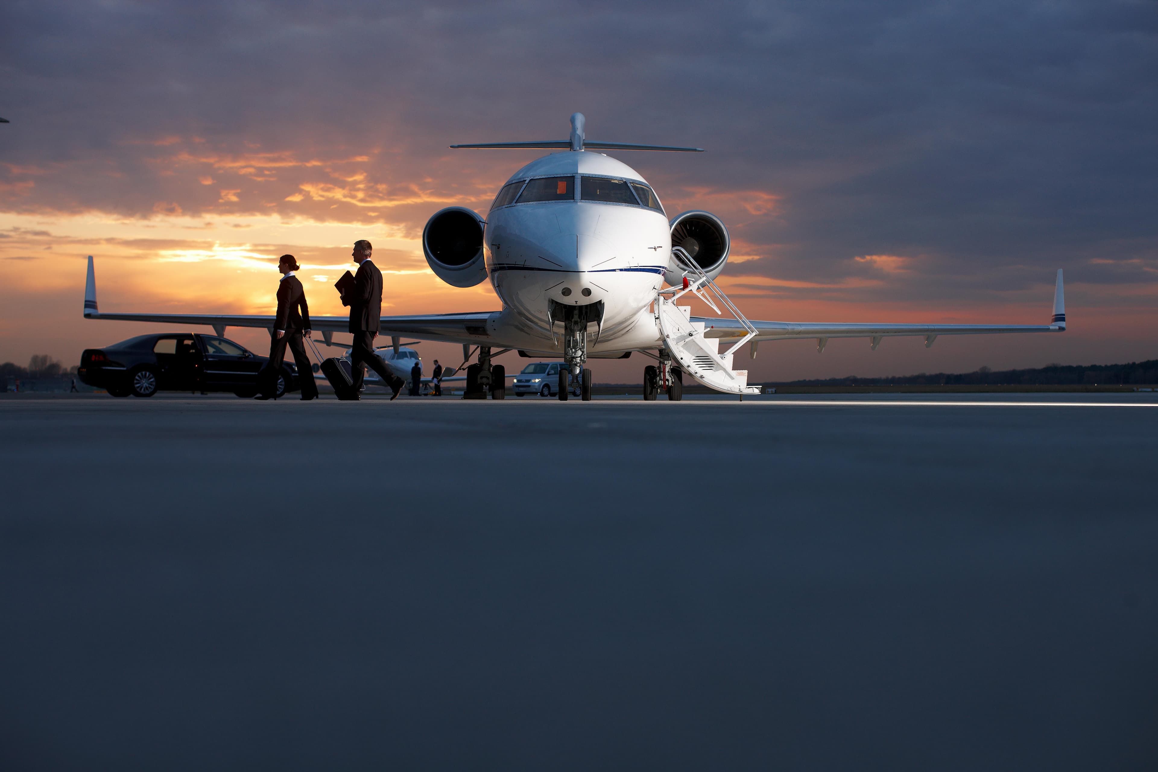 Luxury private jet at sunset